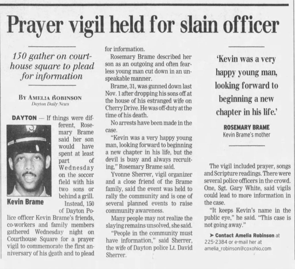 Image of article titled "Prayer vigil held for slain officer" from Dayton Daily News